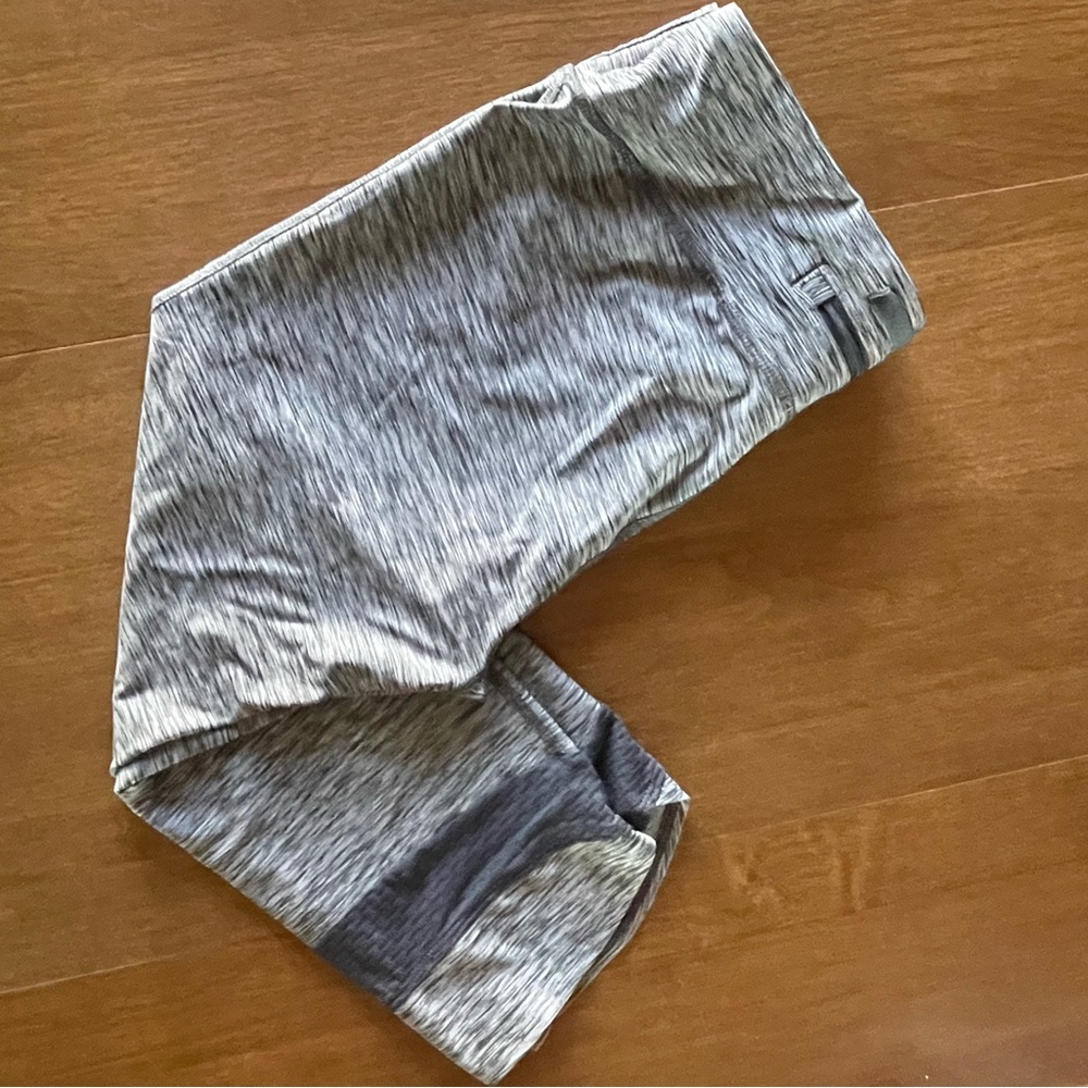 Under Armour athletic fit capri yoga pants, gray stripped zipper pocket.